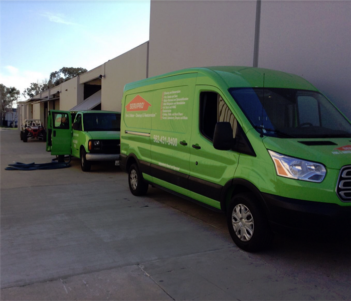 SERVPRO vehicles outside of a building
