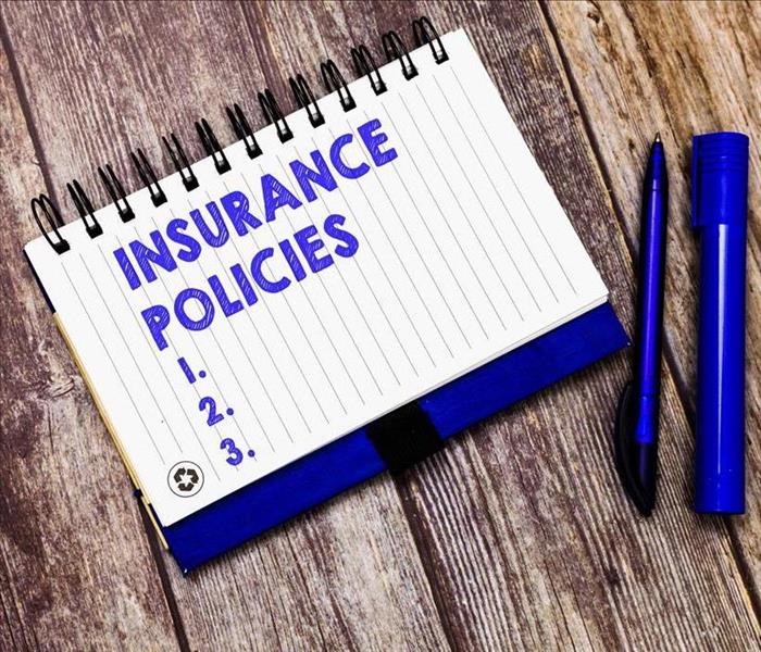 insurance policy pad on a table