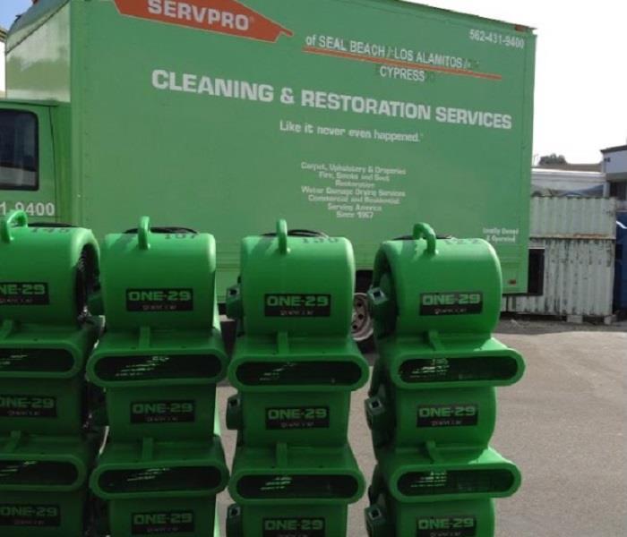 SERVPRO drying equipment stacked in front of SERVPRO truck